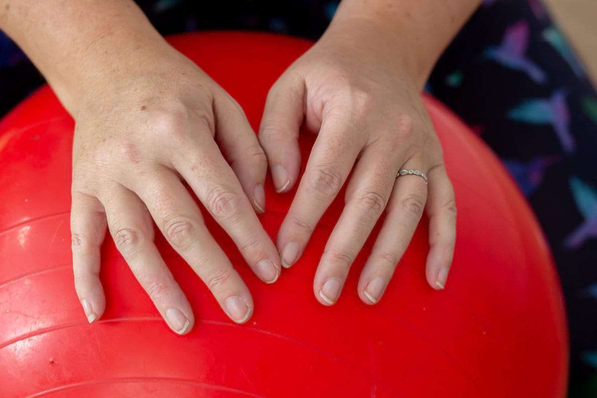 Hands on an exercise ball